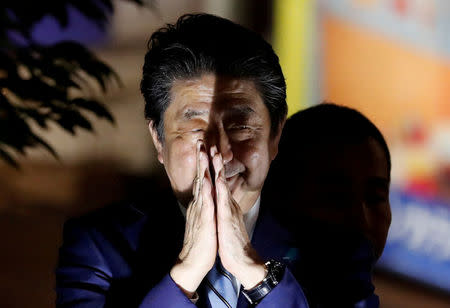 FILE PHOTO: Japan's Prime Minister Shinzo Abe gestures at an election campaign rally in Tokyo, Japan October 20, 2017. REUTERS/Kim Kyung-Hoon/File Photo