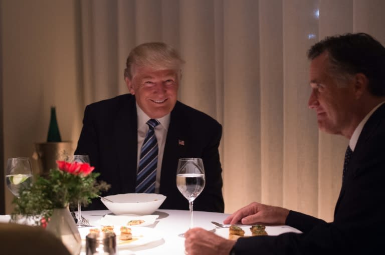 US President-elect Donald Trump (L) dines with Mitt Romny (R) at Jean-Georges restaurant on November 29, 2016 in New York