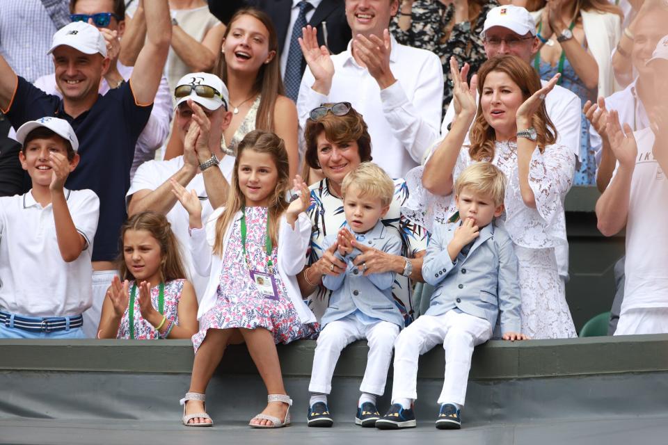 Roger Federer's wife Mirka Federer and their four children, identical twin daughters Myla and Charlene, 7, and identical 3-year-old twin sons Leo and Lenny, cheer from the stands after the Gentlemen's Singles final won by Roger Federer during the Wimbledon Lawn Tennis Championships at the All England Lawn Tennis and Croquet Club at Wimbledon on July 16, 2017 in London, England.