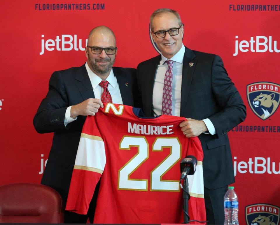 Florida Panthers general manager Bill Zito, at left, introduces new coach Paul Maurice and his team jersey during a press conference at the FLA Live Arena in Sunrise Florida on Thursday, June 23, 2022.