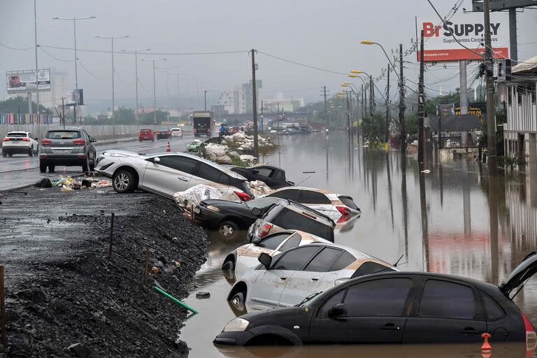Los expertos prevén que las proyecciones de crecimiento pueden llegar a variar por el impacto de las inundaciones en el sur de Brasil (Photo by Nelson ALMEIDA / AFP)