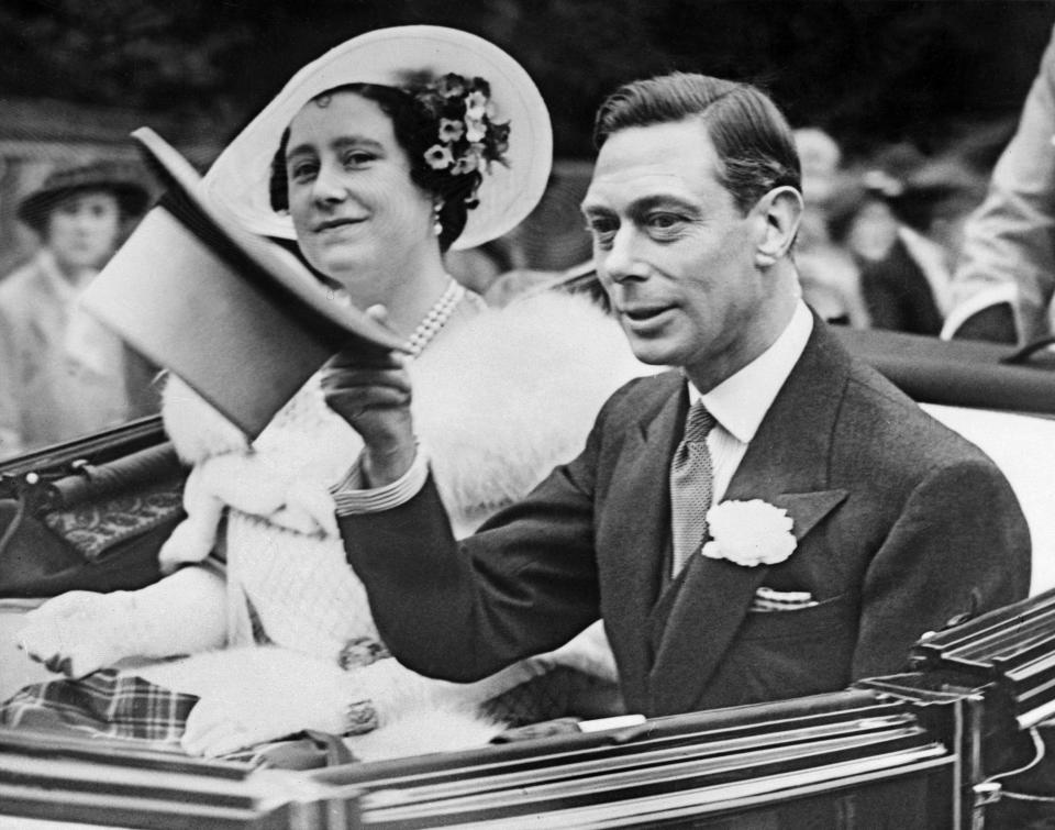 King George VI and his consort, Queen Elizabeth, in a carriage in London on June 26, 1938.