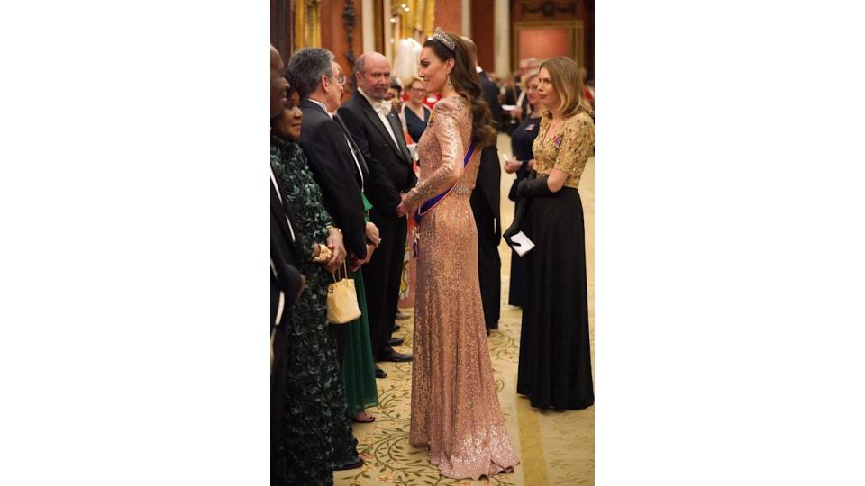 Kate Middleton in sequin dress chatting with guests at diplomatic reception