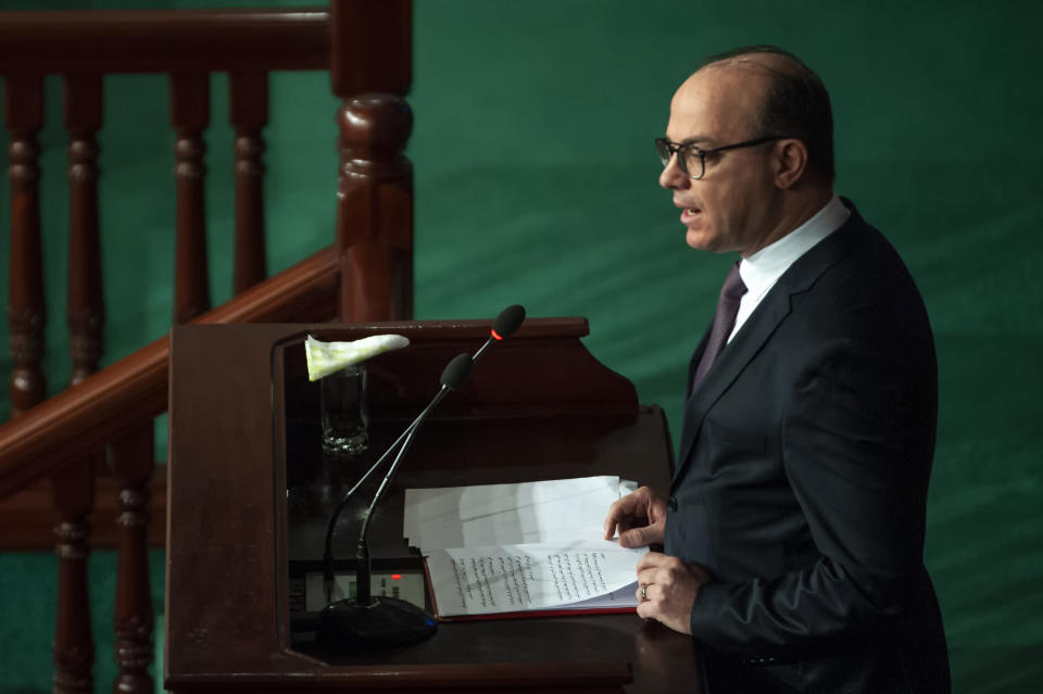 Tunisian designated Prime Minister Elyes Fakhfakh delivers his speech at the parliament, Wednesday, Feb. 26, 2020. Tunisia's parliament is expected to hold a confidence vote Wednesday on designated prime minister Elyes Fakhfakh's government. (AP Photo/Hassene Dridi)