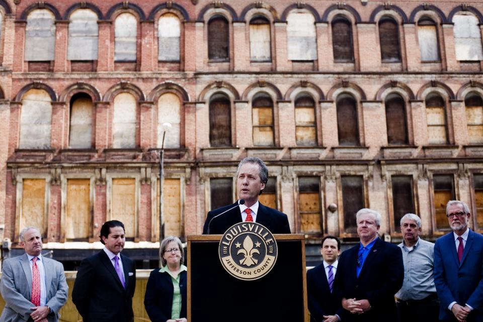 Then-Mayor Greg Fischer speaks at a May 2011 press conference announcing plans to preserve historic Whiskey Row on Main Street.