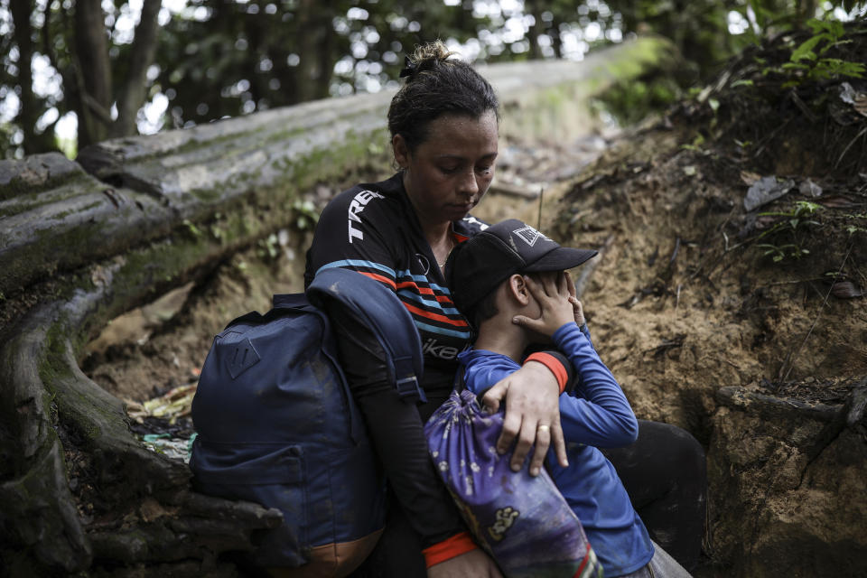 Venezuelan migrants take a break during their walk across the Darien Gap from Colombia to Panama, in hopes of reaching the U.S., Tuesday, May 9, 2023. Pandemic-related U.S. asylum restrictions, known as Title 42, are to expire Thursday, May 11. (AP Photo/Ivan Valencia)