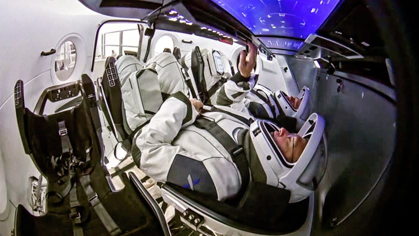 HAWTHORNE, CALIF. -- WEDNESDAY, DECEMBER 19, 2018: NASA Astronauts Doug Hurley, closest, and Robert L. Behnken practice docking the Crew Dragon capsule with the International Space Station at SpaceX in Hawthorne before their flight that is scheduled next summer. Photos taken at SpaceX in Hawthorne, Calif., on Dec. 19, 2018. (Allen J. Schaben / Los Angeles Times)