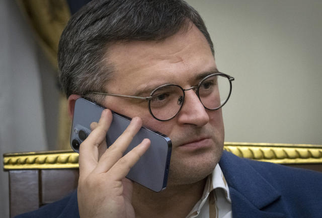 Ukraine's Foreign Minister Dmytro Kuleba talks over the phone before an interview with The Associated Press in Kyiv, Ukraine, Monday, Dec. 26, 2022. (AP Photo/Efrem Lukatsky)