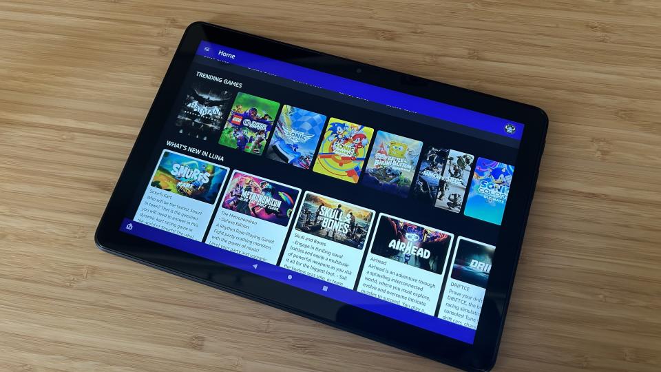 Amazon Luna running on Fire HD 10 on a wooden desk