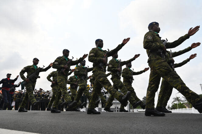 <span>Des militaires ivoiriens défilent à Abidjan, en février 2020</span><div><span>ISSOUF SANOGO</span><span>AFP</span></div>