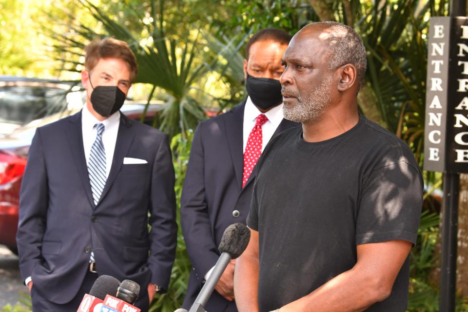 Crosley Green talks to the media outside the federal probation office in Cocoa in 2021, behind him are two of his pro bono attorneys Robert Rhoad and Keith Harrison.
(Credit: MALCOLM DENEMARK/FLORIDA TODAY)