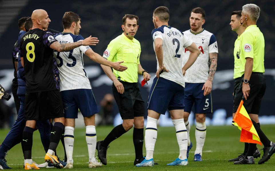 Peter Bankes gives a red card to Tottenham goalkeeping coach Nuno Santos. - Eddie Keogh Telegraph Media Group