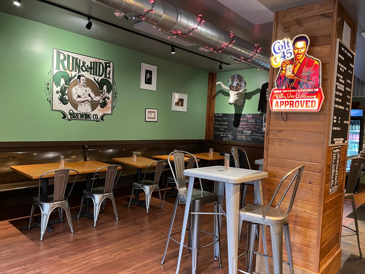 The interior of Run & Hide Brewing Co. in Port Chester which features humorous slogans, deer and cow horns. Photographed April 2024