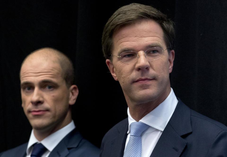 Netherlands' caretaker Prime Minister Mark Rutte, right, and Labor Party Leader Diederik Samsom, left, attend a joint news conference in The Hague, Netherlands, Monday Oct. 29, 2012. The Netherlands is close to getting a new coalition government after lawmakers from the two biggest parties approved a policy deal hammered out by their leaders. Rutte, leader of the pro-free market VVD party, and center-left Labor Party chief Samsom have been negotiating behind closed doors for weeks to resolve policies for their proposed coalition. (AP Photo/Peter Dejong)