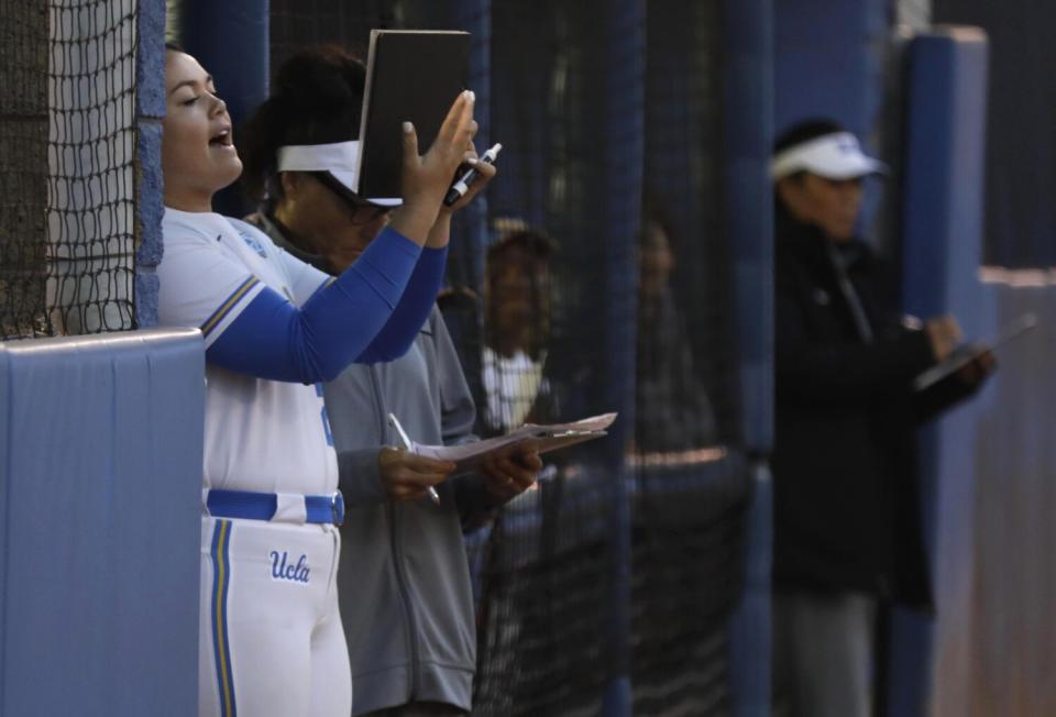 UCLA bullpen catcher Taylor Sullivan calls out instructions during a game against Utah.