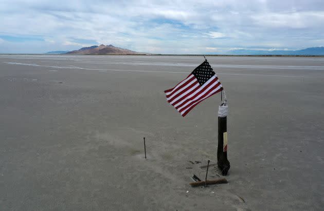 An American flag waves over a part of the Great Salt Lake that used to be underwater. (Photo: Justin Sullivan via Getty Images)