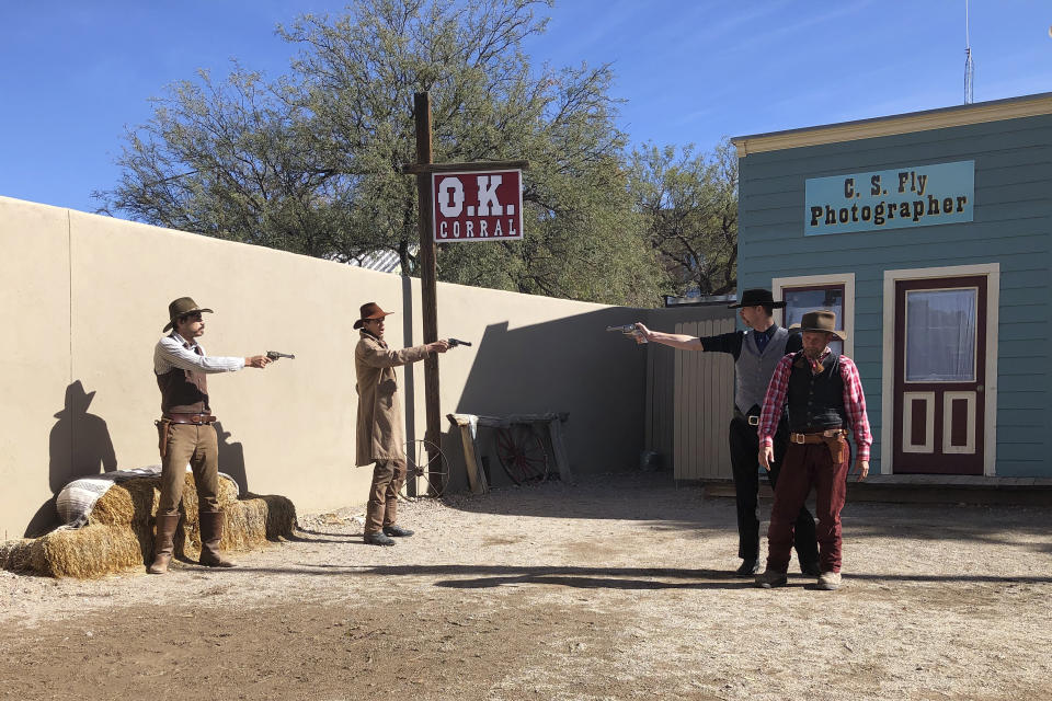 Actors are seen reenacting the events that led to an 1881 shootout in the town that left three dead and became one of the most famous gun battles in the Old West on Saturday, Nov. 20, 2019 in Tombstone, Ariz. Numerous books and movies have been based on the shootout. Tombstone was founded and flourished in the late 19th century after large amounts of silver were found in the area. (AP Photo/Peter Prengaman)