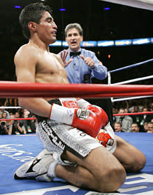 Erik Morales of Mexico suffers the first of two knockdowns in the third round