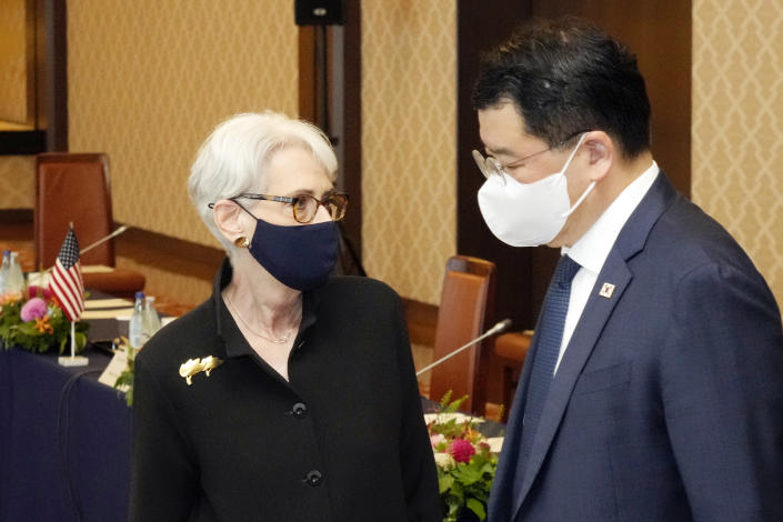 U.S. Deputy Secretary of State Wendy Sherman, left, and South Korean First Vice Foreign Minister Choi Jong Kun, right, walk in the meeting venue with Japanese Vice-Minister for Foreign Affairs Takeo Mori prior to their trilateral meeting at the Iikura Guesthouse Wednesday, July 21, 2021, in Tokyo. (AP Photo/Eugene Hoshiko)