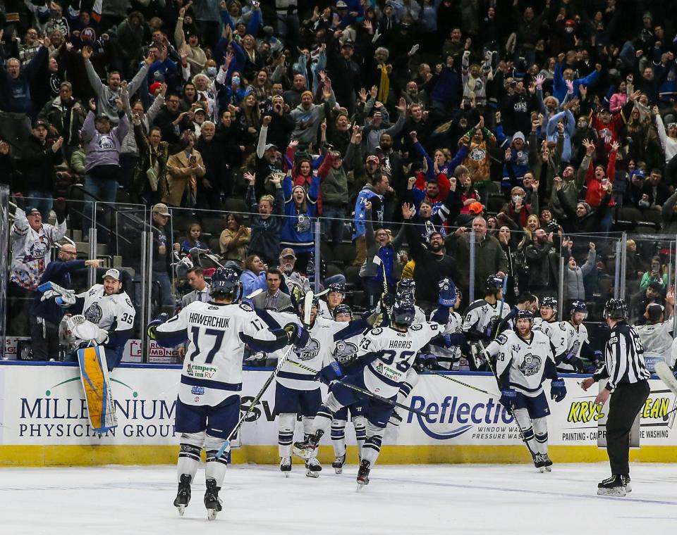 Jacksonville Icemen celebrate their overtime win of an ECHL hockey game against the South Carolina Stingrays at Veterans Memorial Arena in Jacksonville, Fla., Saturday, Jan. 22, 2022.  [Gary Lloyd McCullough/For the Jacksonville Icemen]