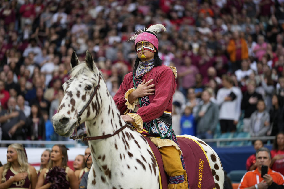 Florida State Seminoles mascot Chief Osceola rides Renegade during the playing of the national anthem at the start of the Orange Bowl NCAA college football game against Georgia, Saturday, Dec. 30, 2023, in Miami Gardens, Fla. (AP Photo/Rebecca Blackwell)