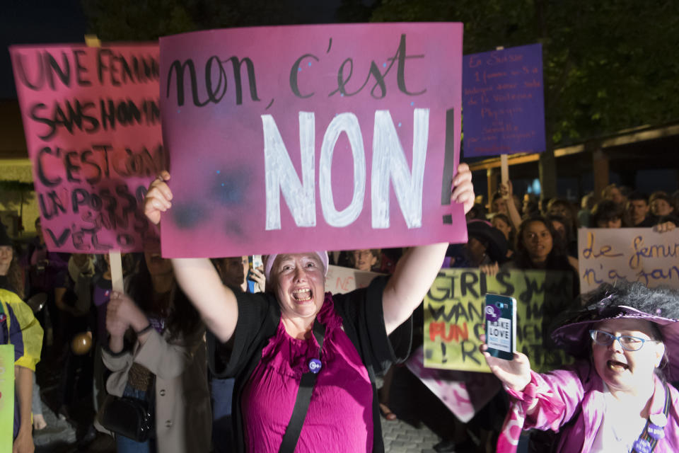 People protest during a nationwide women's strike on Friday, June 14, 2019, in Lausanne, Switzerland. There is list of several reasons motivating people to take part in the strike. These range from unequal wages to pressures on part-time employees, the burden of household work and sexual violence. (Laurent Gillieron/Keystone via AP)