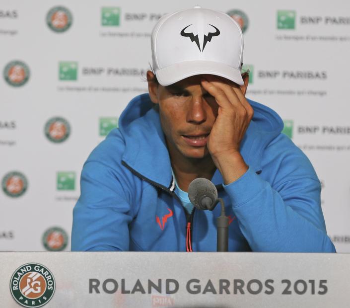 A downcast Nadal tries to make sense of all in his press conference. (AP Photo/David Vincent)