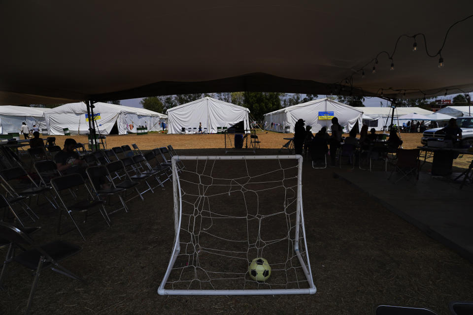 A soccer ball sits in a portable soccer goal at a camp for Ukrainian refugees in the Iztapalapa borough of Mexico City, Tuesday, May 24, 2022. Mexico City will close the camp that has hosted hundreds of Ukrainian refugees for the past month. Now that a U.S. program vetting refugees and then allowing them to fly to the U.S. is operational, authorities say the camp is no longer needed. (AP Photo/Marco Ugarte)