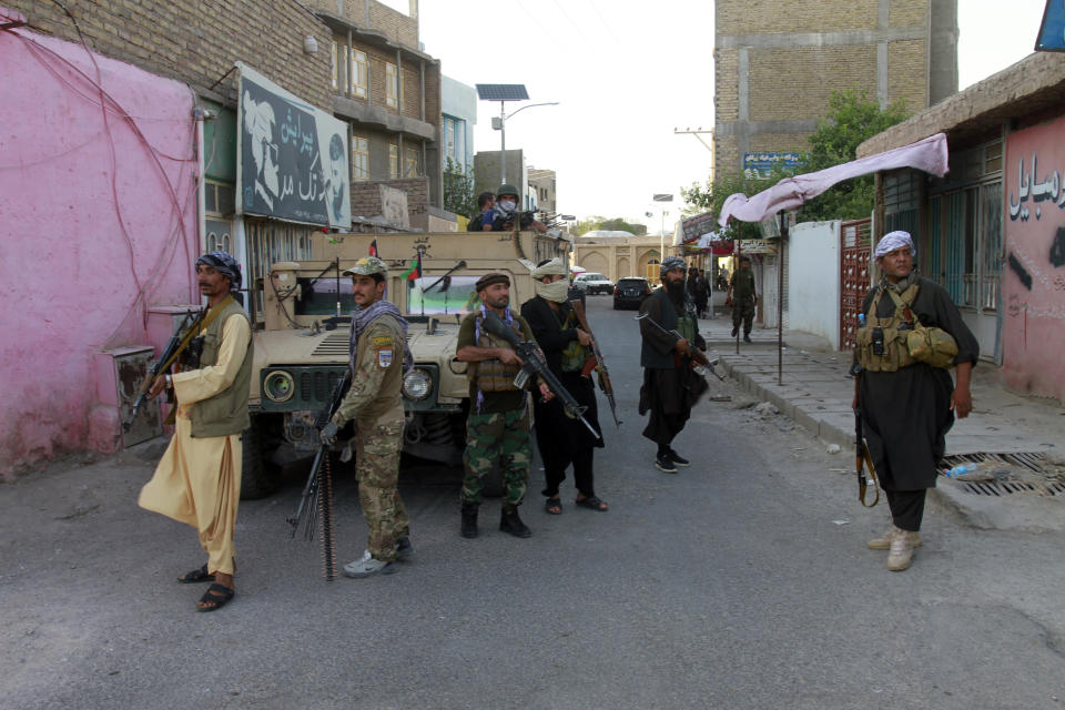 Private militia loyal to Ismail Khan, the former Mujahideen commander patrols after security forces took back control of parts of Herat city following fighting between Taliban and Afghan security forces in Herat province, west of Kabul, Afghanistan, Friday, Aug. 6, 2021. (AP Photo/Hamed Sarfarazi)