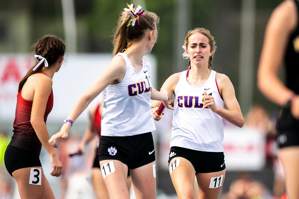 Nevada's Alexa Betting (rear) hands the baton off to Ava Vanderheyden during the Class 3A girls 4x800-meter relay during the high school state track and field championships, Thursday, May 18, 2023, at Drake Stadium in Des Moines, Iowa.