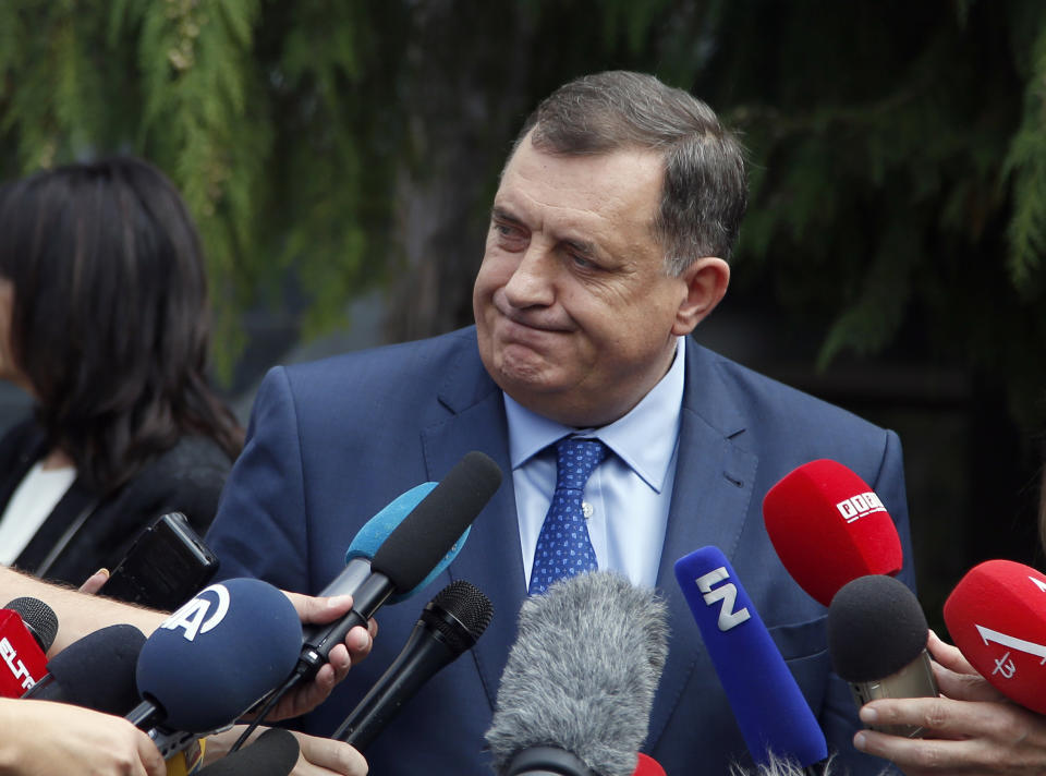 President of the Republic of Srpska Milorad Dodik speaks to journalists after voting in a general election in Laktasi, northwest of Sarajevo, Bosnia, Sunday, Oct. 7, 2018. Bosnians were voting Sunday in a general election that could install a pro-Russian nationalist to a top post and cement the ethnic divisions of a country that faced a brutal war 25 years ago. (AP Photo/Darko Vojinovic)