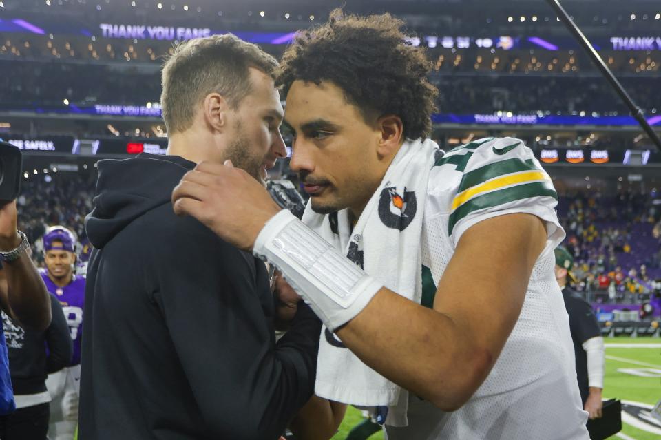 Green Bay Packers' Jordan Love talks to Minnesota Vikings Kurt Cousins after an NFL football game Sunday, Dec. 31, 2023, in Minneapolis. The Packers won 33-10. (AP Photo/Bruce Kluckhohn)