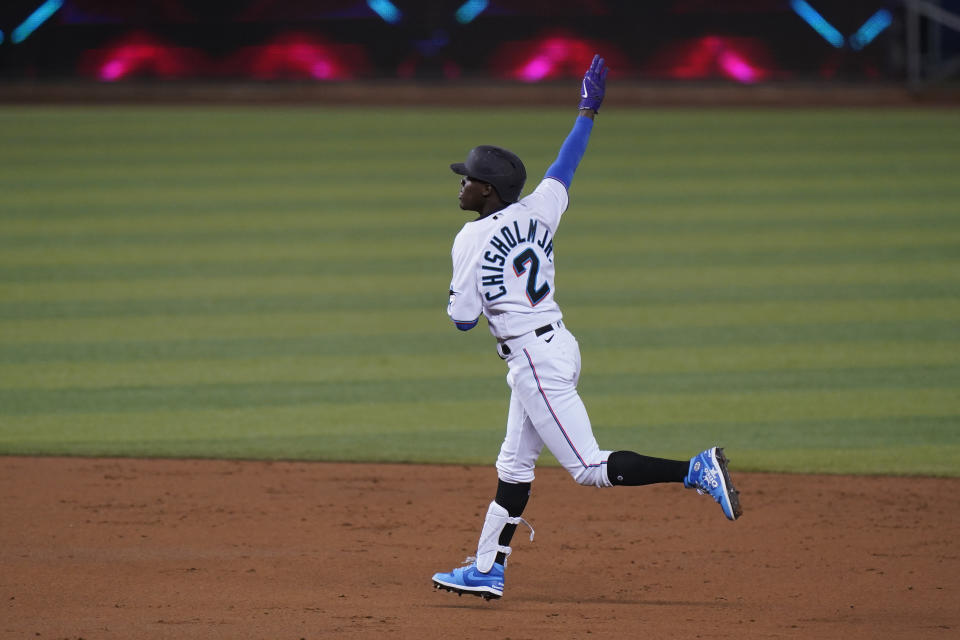 Miami Marlins' Jazz Chisholm Jr., celebrates after he hit a three-run home-run also scoring Jose Devers and Jon Berti during the second inning of a baseball game against the Colorado Rockies, Thursday, June 10, 2021, in Miami. (AP Photo/Wilfredo Lee)