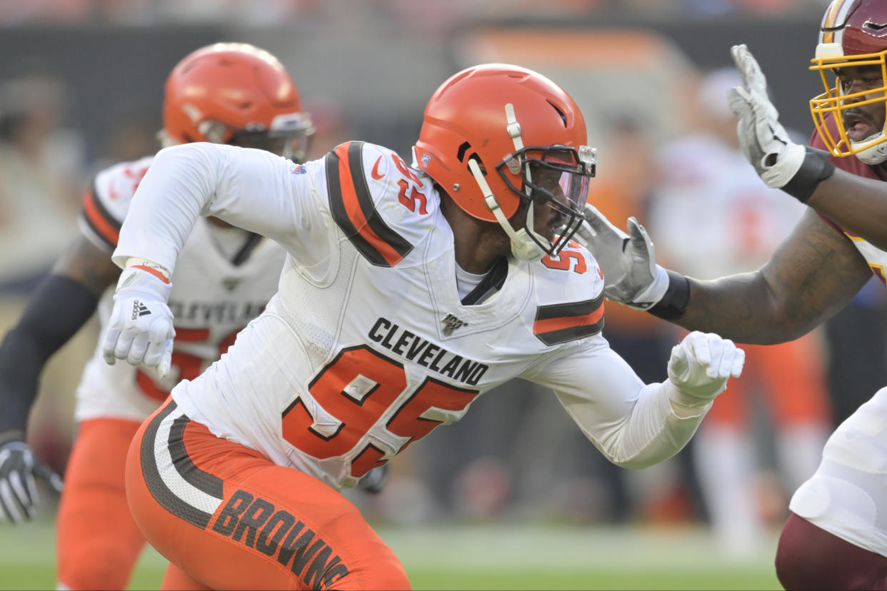 FILE - In this Aug. 8, 2019, file photo, Cleveland Browns defensive end Myles Garrett (95) rushes the passer during an NFL preseason football game against the Washington Redskins in Cleveland. Cleveland’s defensive line could be the team’s greatest strength, and Pro Bowl defensive end Myles Garrett may be on the verge of becoming the league’s most unstoppable force. (AP Photo/David Richard, File)