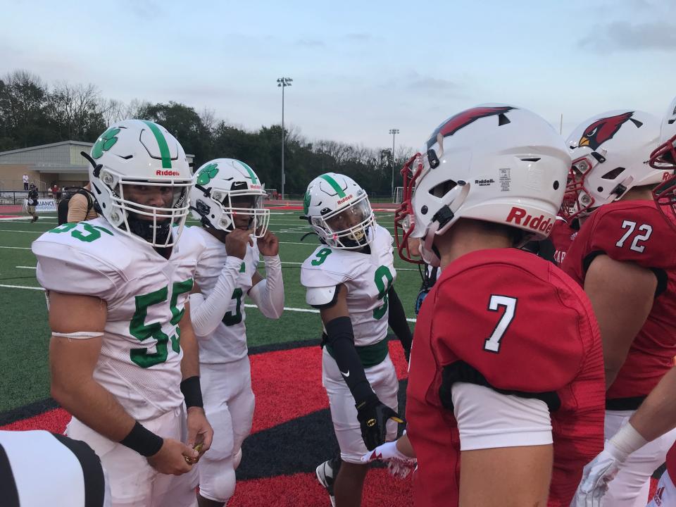 South Plainfield football captains Justin Hannon (55), Emmanuelle White (5) and Patrick Smith (9) shake hands with Westwood captains before their 2023 season opener in the Jim Grasso Kickoff Classic on Friday, Aug. 25, 2023.