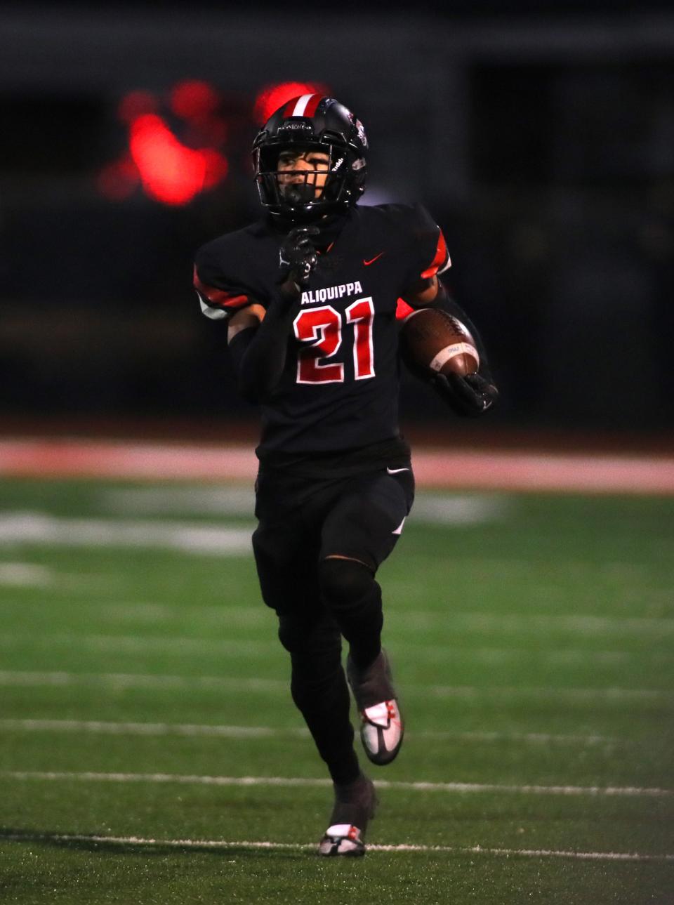 Aliquippa's Donovan Walker sprints downfield after intercepting a pass during the second half against Central Valley Friday night at Jimbo Covert Field in Freedom, PA.