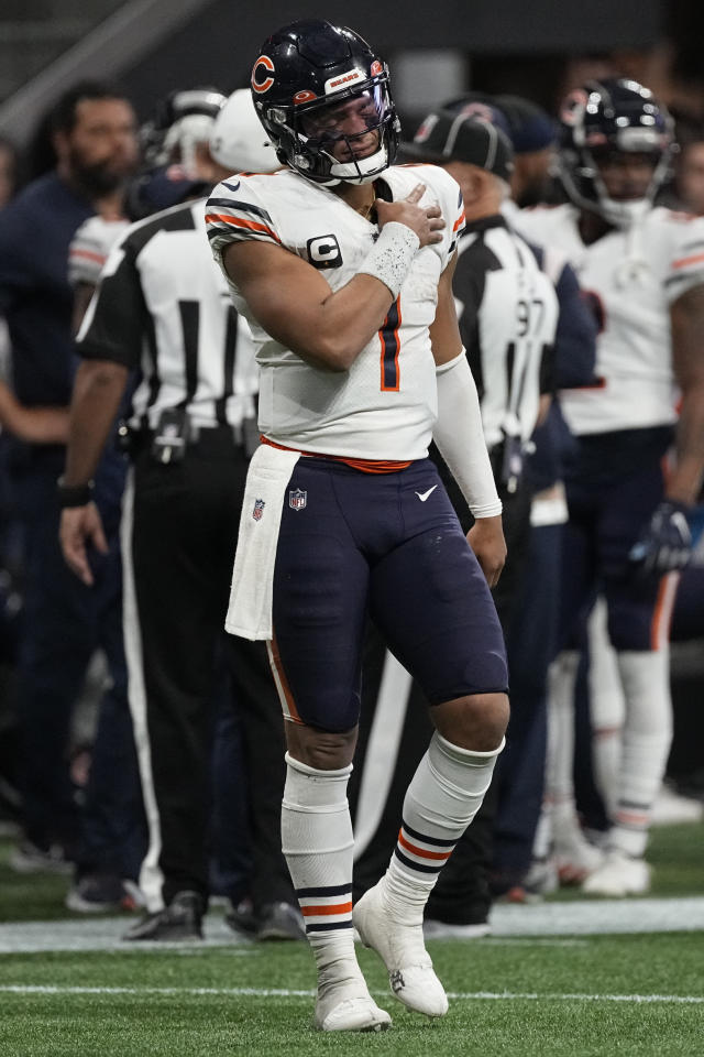 Chicago Bears quarterback Trevor Siemian (15) stands on the field during  the first half of an NFL football game against the Minnesota Vikings,  Sunday, Oct. 9, 2022, in Minneapolis. (AP Photo/Abbie Parr