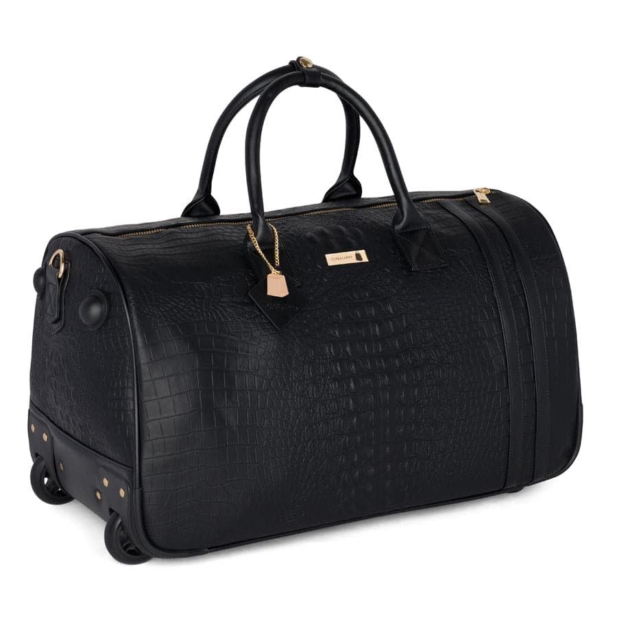 <p><a href="https://go.redirectingat.com?id=74968X1596630&url=https%3A%2F%2Fwww.totencarry.com%2Fproducts%2Fblack-apollo-2-crocodile-skin-rolling-duffle-bag&sref=https%3A%2F%2Fwww.cosmopolitan.com%2Flifestyle%2Fg61210004%2Fbest-rolling-duffel-bag%2F" rel="nofollow noopener" target="_blank" data-ylk="slk:Shop Now;elm:context_link;itc:0;sec:content-canvas" class="link rapid-noclick-resp">Shop Now</a></p><p>Black Apollo 2 Faux Crocodile Skin Rolling Duffel Bag</p><p>totencarry.com</p><p>$150.00</p><span class="copyright">Tote & Carry</span>