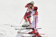 Feb 23, 2018; Pyeongchang, South Korea; Katharina Gallhuber (AUT) celebrates with Wendy Holdener (SUI) compete in the mixed team 1/8 big finals during the Pyeongchang 2018 Olympic Winter Games at Yongpyong Alpine Centre. Mandatory Credit: Eric Bolte-USA TODAY Sports