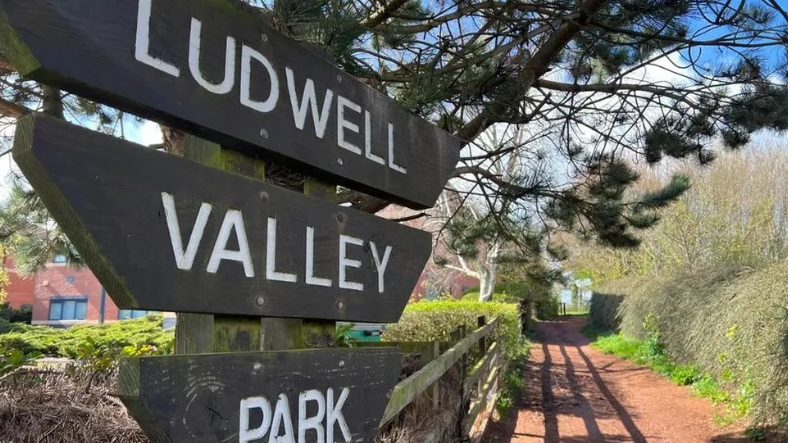 A sign which reads 'Ludwell Valley Park'