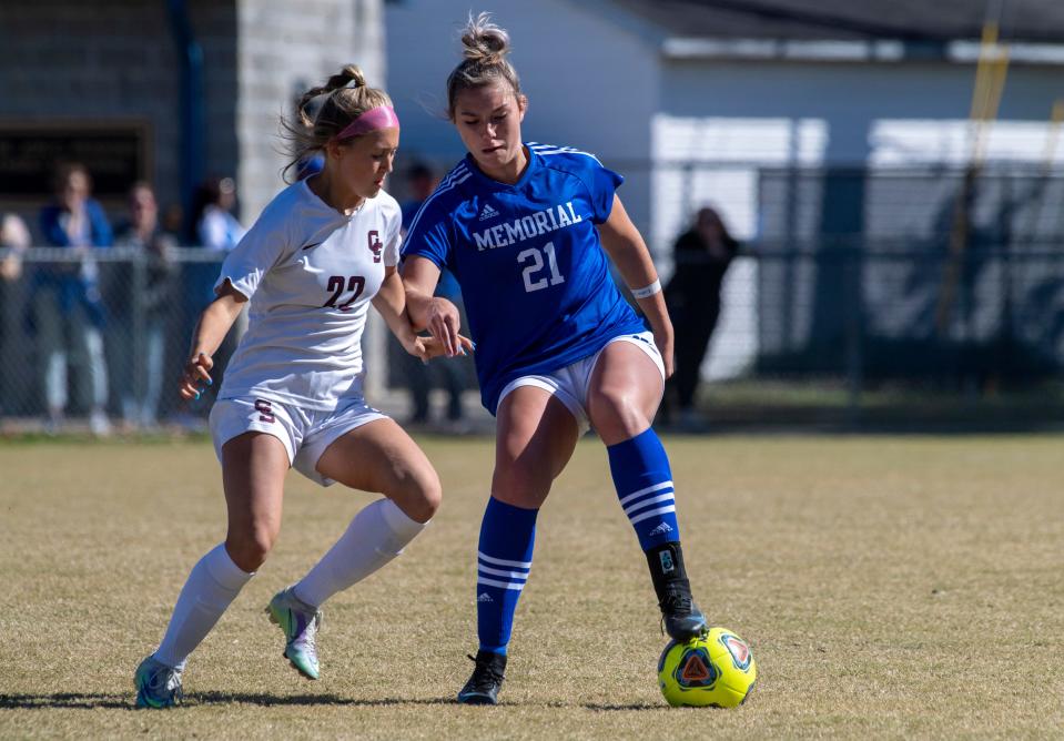 Gibson Southern's Corinne Stevens (22) defends Memorial's Emily Mattingly (21) as the Memorial Tigers play the Gibson Southern Titans during the Girls 2A Soccer Sectional #32 championship at Memorial High School in Evansville, Ind., Saturday afternoon, Oct. 8, 2022. 