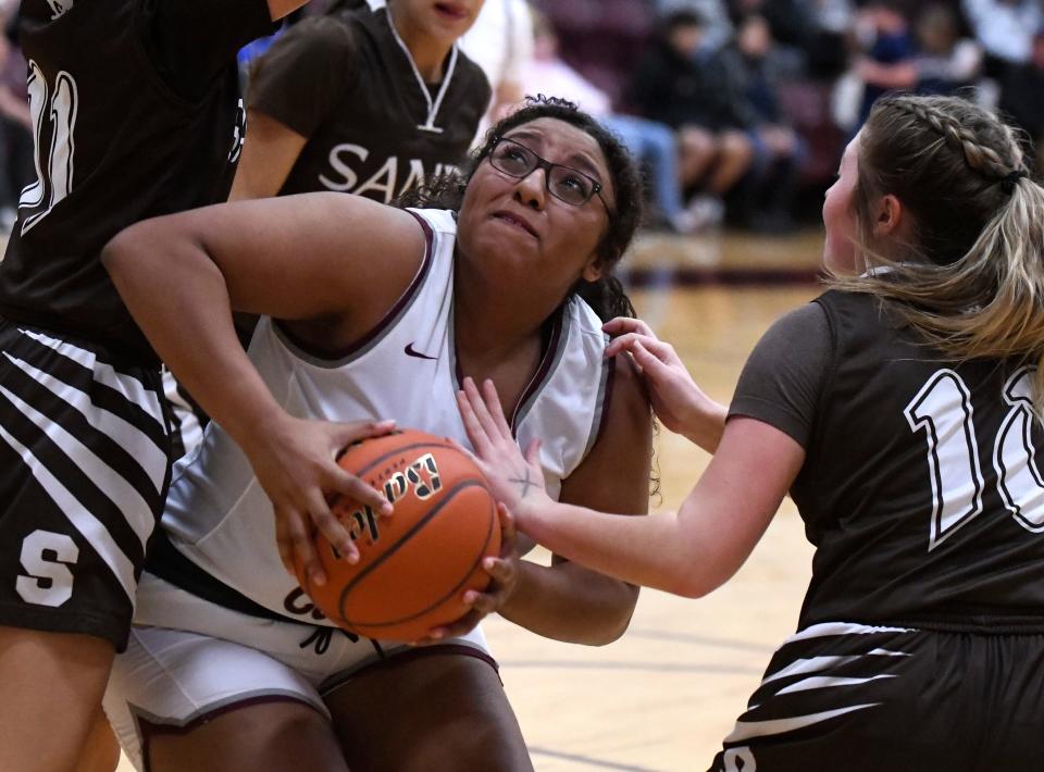 Klondike's Maya Howard gathers the ball before a shot against Sands in a District 8-1A basketball game Thursday, Feb. 2, 2023, at Cougar Gymnasium in Klondike.