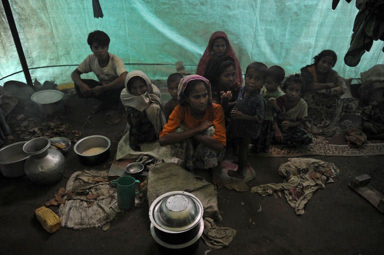 Muslim Rohingyas sitting inside their collective tent at the Dabang Internally Displaced Persons (IDP) camp in October 2012. A top UN envoy Friday raised concerns about the plight of hundreds of thousands of people forced from their homes by unrest in Myanmar, after visiting camps in the country's conflict-hit west and north