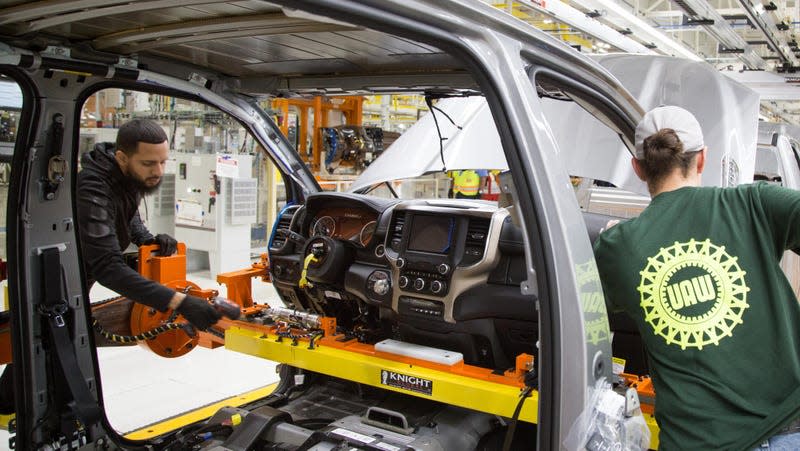 FCA US team members install the instrument panel on the all-new 2019 Ram 1500 at the Sterling Heights (Mich.) Assembly Plant (SHAP).