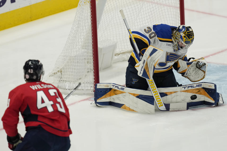 St. Louis Blues goaltender Joel Hofer (30) blocks a shot by Washington Capitals right wing Tom Wilson (43) during the first period of an NHL hockey game Friday, March 17, 2023, in Washington. (AP Photo/Carolyn Kaster)