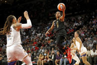 FILE - Las Vegas Aces guard Riquna Williams (2) lays up the ball during the second half of Game 1 in the semifinals of the WNBA playoffs against the Phoenix Mercury Tuesday, Sept. 28, 2021, in Las Vegas. Phoenix Mercury center Brittney Griner (42) is at left. Criminal domestic violence charges were dismissed Thursday, Sept. 7, 2023, against Las Vegas Aces player Riquna Williams after a prosecutor said her wife, her alleged victim in a July 25 incident at their home, refused to appear for a preliminary hearing to determine if the case should go to trial.(AP Photo/Steve Marcus, File)