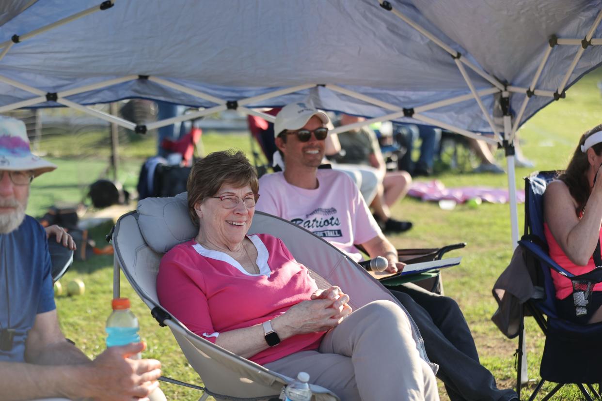 Linda Gauzza, who is battling breast cancer, watches her granddaughter Lyla Dwyer play for John Jay during its May 1, 2024 "Pink Out" softball game, which raised money for Miles of Hope Breast Cancer Foundation.