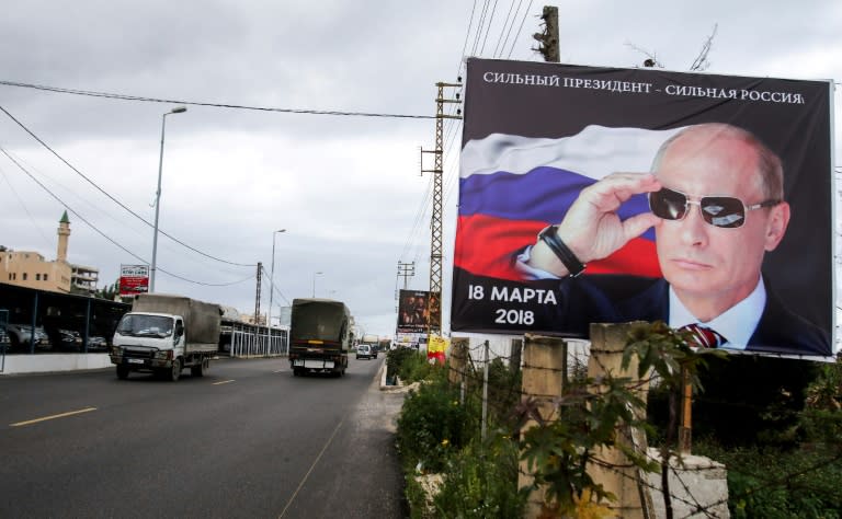 Vladimir Putin, seen here on a billboard in south Lebanon, has stamped his total authority in Russia, silencing opposition and reasserting Moscow's lost might abroad 