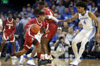 Alabama's James Bolden, left, looks for an opening on Kentucky's Nick Richards (4) during the first half of an NCAA college basketball game in Lexington, Ky., Saturday, Jan 11, 2020. (AP Photo/James Crisp)