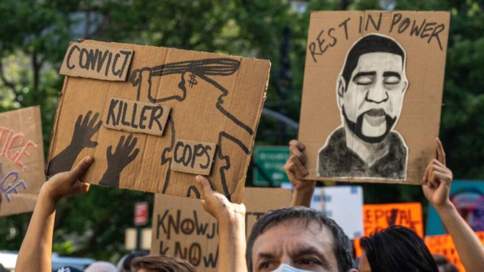 Protesters at a rally calling for police reform